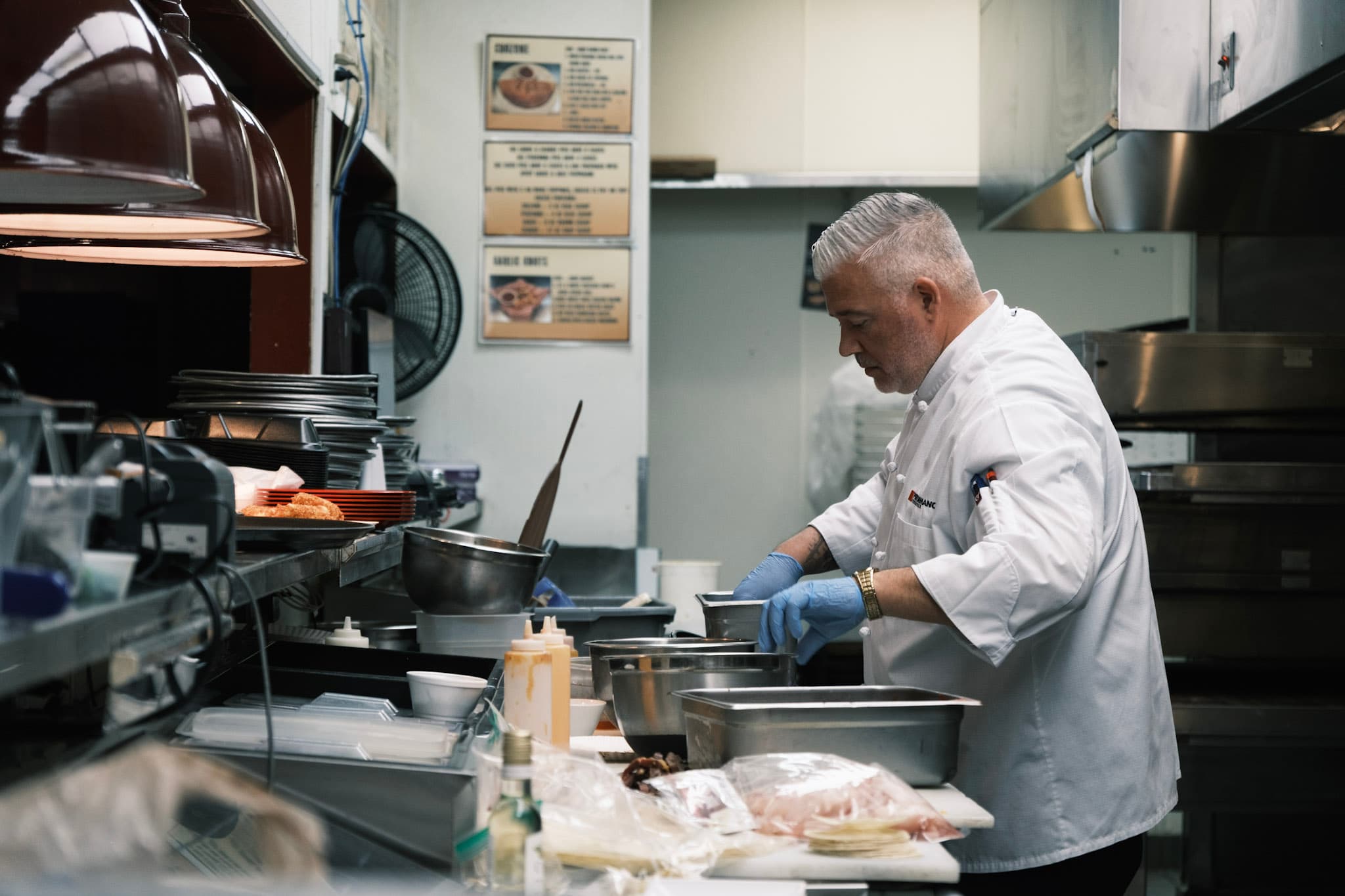 Chef preparing food in the Chos kitchen