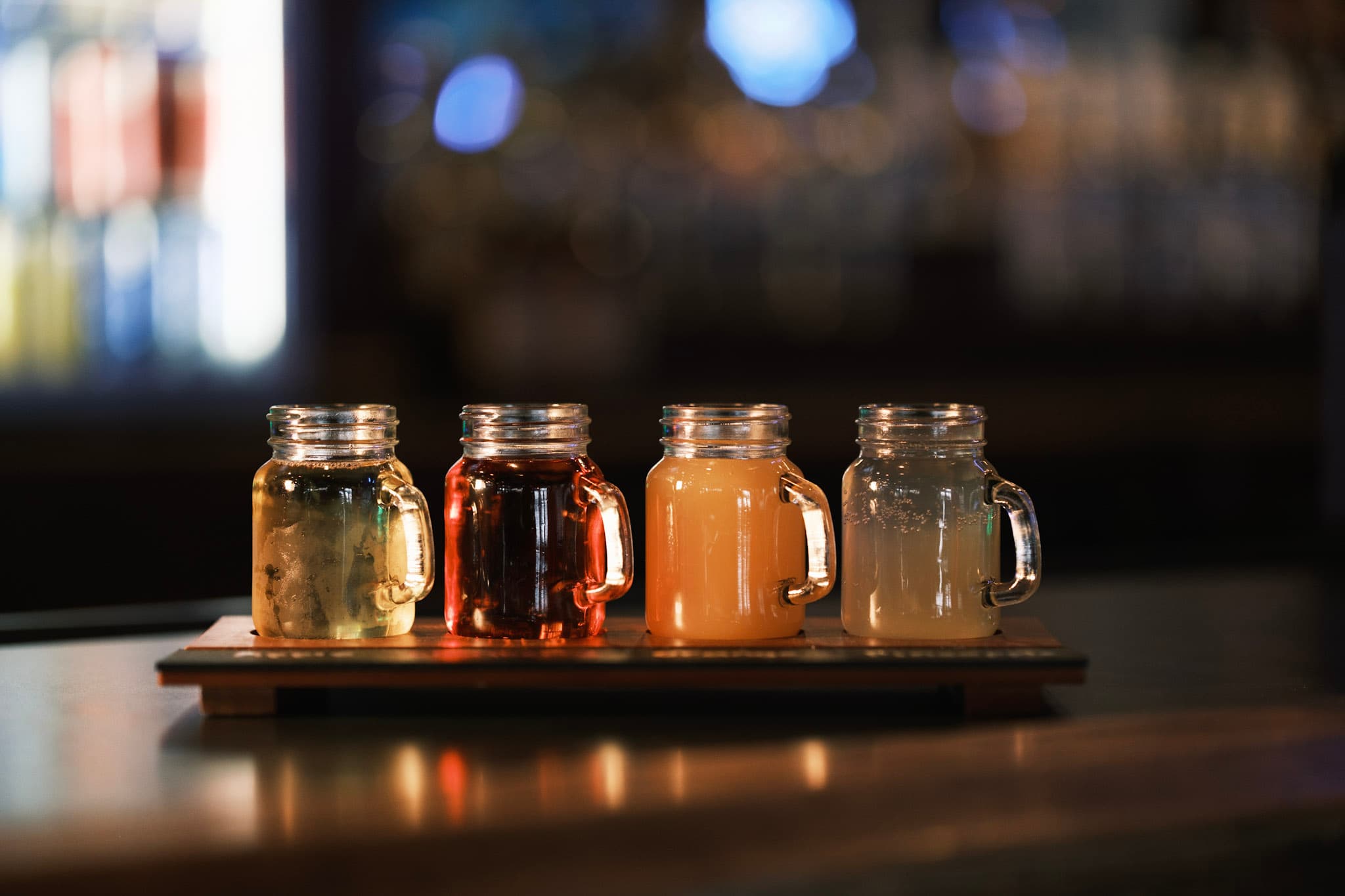 Moody bar interior with beer flight